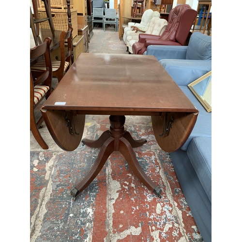 211 - A Georgian style mahogany drop leaf dining table