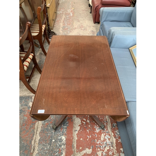 211 - A Georgian style mahogany drop leaf dining table