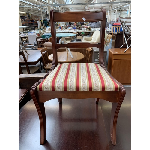 212 - A Georgian style mahogany twin pedestal extending D end dining table and six chairs