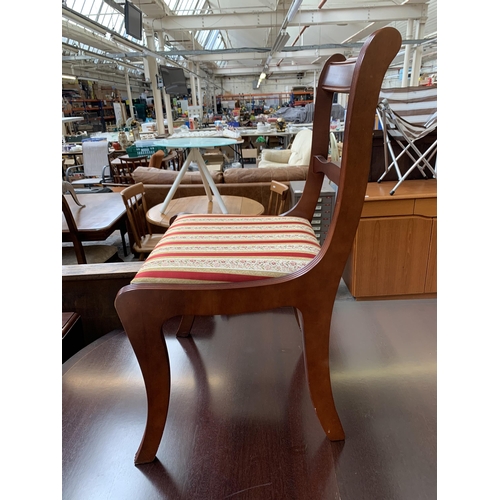 212 - A Georgian style mahogany twin pedestal extending D end dining table and six chairs