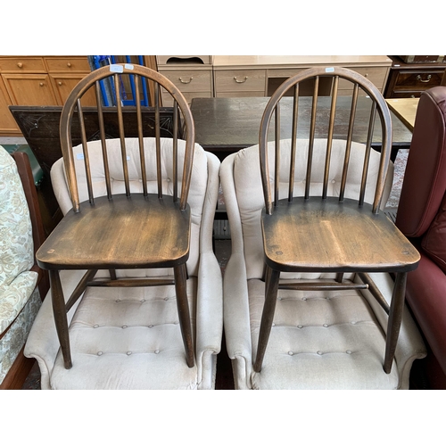 213 - A pair of mid 20th century Ercol Windsor F182 beech dining chairs