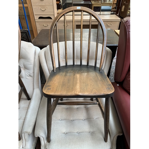 213 - A pair of mid 20th century Ercol Windsor F182 beech dining chairs