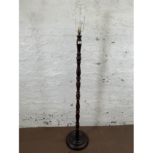 214 - A beech standard lamp with circular base - approx. 140cm high