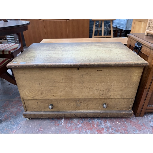 216 - A Victorian scumble pine blanket box with lower drawer - approx. 56cm high x 94cm wide x 56cm deep