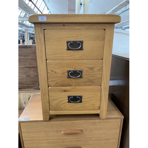 218 - A modern solid oak bedside chest of drawers - approx. 66cm high x 48cm wide x 44cm deep