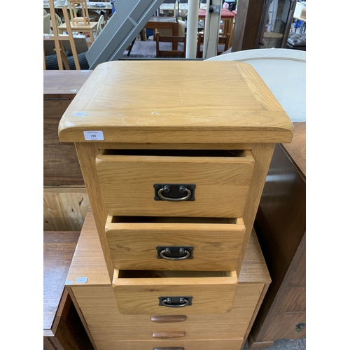 218 - A modern solid oak bedside chest of drawers - approx. 66cm high x 48cm wide x 44cm deep