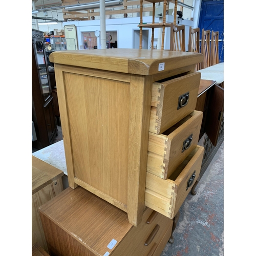 218 - A modern solid oak bedside chest of drawers - approx. 66cm high x 48cm wide x 44cm deep