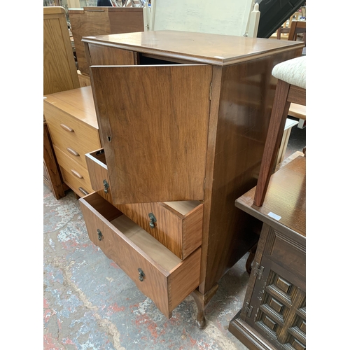 220 - A Raleigh Furniture walnut cabinet with two upper cupboard doors and two lower drawers on cabriole s... 