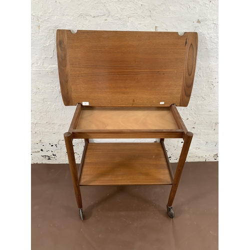 223 - A mid 20th century teak two tier cocktail trolley with removable tray - approx. 70cm high x 46cm wid... 