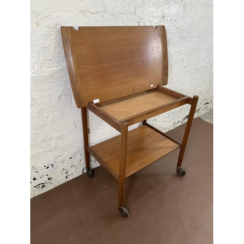 223 - A mid 20th century teak two tier cocktail trolley with removable tray - approx. 70cm high x 46cm wid... 