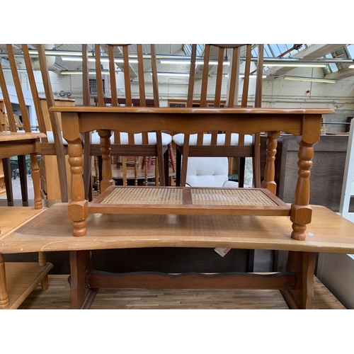 224 - Three pieces of occasional furniture, one pine three tier side table, one beech and rattan two tier ... 