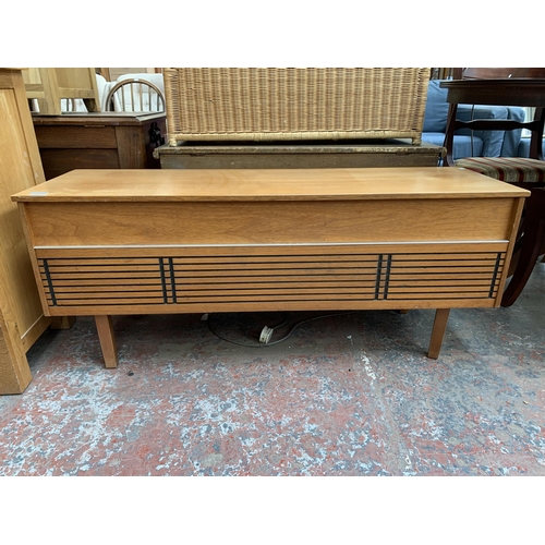 229 - A mid 20th century teak radiogram fitted with Wye three band receiver and BSR three speed autochange... 