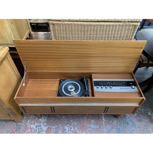 229 - A mid 20th century teak radiogram fitted with Wye three band receiver and BSR three speed autochange... 