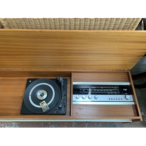 229 - A mid 20th century teak radiogram fitted with Wye three band receiver and BSR three speed autochange... 