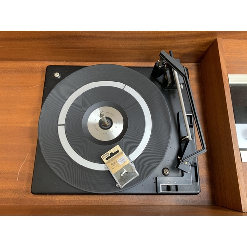 229 - A mid 20th century teak radiogram fitted with Wye three band receiver and BSR three speed autochange... 