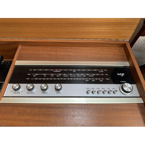 229 - A mid 20th century teak radiogram fitted with Wye three band receiver and BSR three speed autochange... 