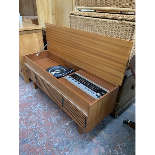 229 - A mid 20th century teak radiogram fitted with Wye three band receiver and BSR three speed autochange... 