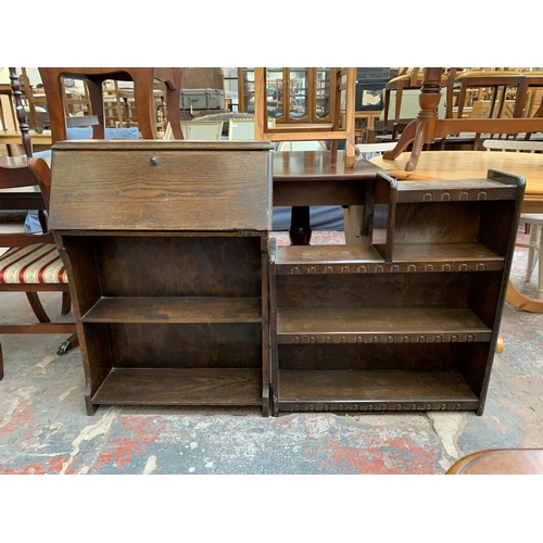 230 - Two pieces of mid 20th century oak furniture, one student's bureau and one three tier bookcase