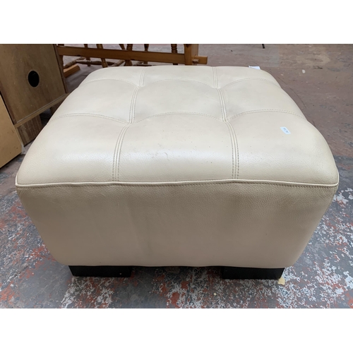 233 - A modern cream leather footstool - approx. 44cm high x 65cm wide x 65cm deep