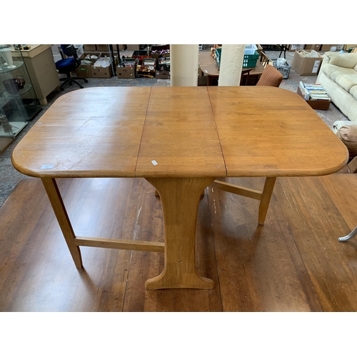 235 - A modern beech drop leaf gateleg dining table - approx. 74cm high x 75cm wide x 120cm long