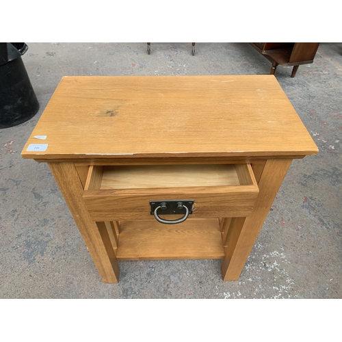 246 - A modern oak side table - approx. 75cm high x 60cm wide x 32cm deep