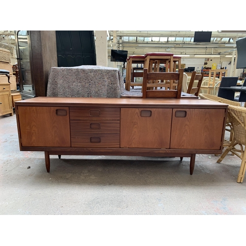 249 - A mid 20th century William Lawrence of Nottingham teak sideboard - approx. 73cm high x 198cm wide x ... 