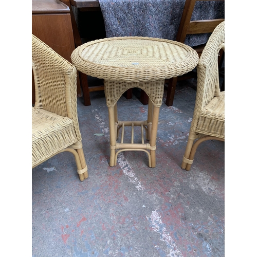 250 - Three pieces of wicker and cane furniture, two armchairs and one circular side table