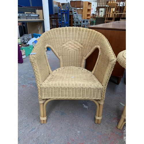 250 - Three pieces of wicker and cane furniture, two armchairs and one circular side table