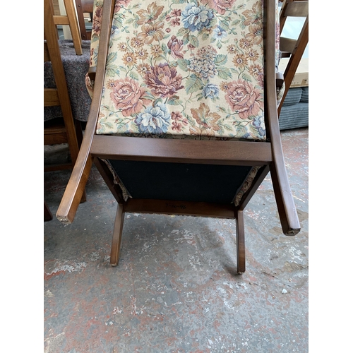 251 - Two late 20th century fabric upholstered and beech armchairs