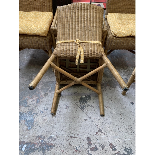 29 - Five pieces of wicker and cane furniture, four dining chairs and one glass top square side table