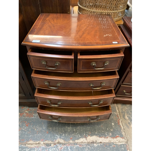 32 - A Georgian style inlaid mahogany miniature bow fronted chest of drawers on bracket supports - approx... 