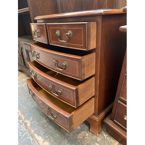 32 - A Georgian style inlaid mahogany miniature bow fronted chest of drawers on bracket supports - approx... 