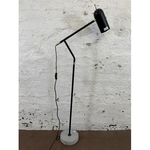 33 - A modern black metal and brass LED floor lamp - approx. 130cm high