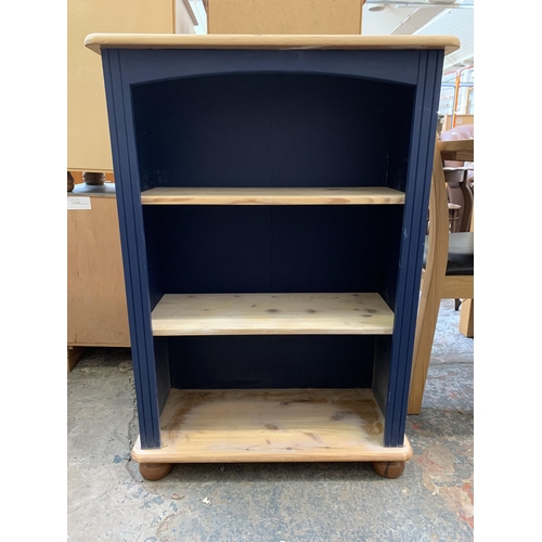 35 - A modern pine and blue painted three tier bookcase - approx. 96cm high x 67cm wide x 29cm deep