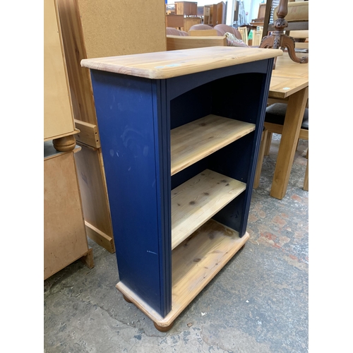 35 - A modern pine and blue painted three tier bookcase - approx. 96cm high x 67cm wide x 29cm deep