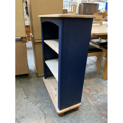 35 - A modern pine and blue painted three tier bookcase - approx. 96cm high x 67cm wide x 29cm deep