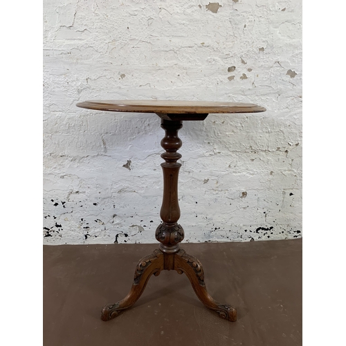 37 - A Victorian inlaid walnut circular tripod games table - approx. 68cm high x 53cm diameter