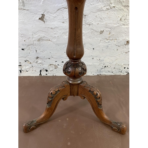 37 - A Victorian inlaid walnut circular tripod games table - approx. 68cm high x 53cm diameter