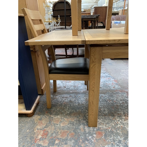 39 - A modern oak rectangular extending dining table and four chairs - approx. 79cm high x 90cm wide x 16... 