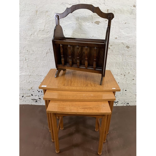 40 - Two pieces of furniture, one oak magazine rack and one mid 20th century teak effect nest of tables