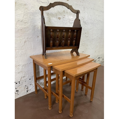 40 - Two pieces of furniture, one oak magazine rack and one mid 20th century teak effect nest of tables