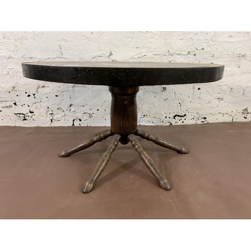 42 - A mid 20th century oak and glass top revolving ships wheel coffee table - approx. 42cm high x 74cm w... 