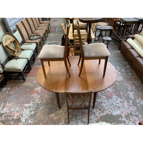 43 - A mid 20th century teak extending dining table and four G Plan teak dining chairs - approx. 71cm hig... 