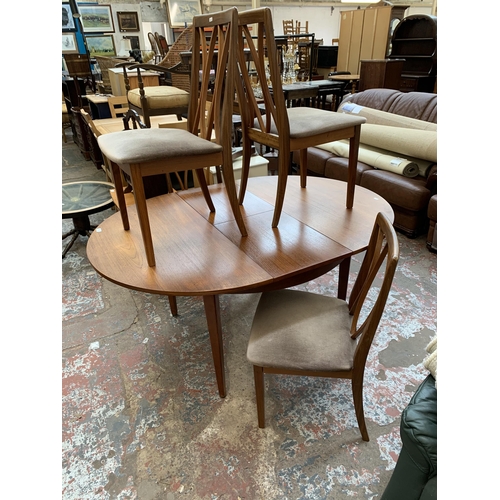 43 - A mid 20th century teak extending dining table and four G Plan teak dining chairs - approx. 71cm hig... 