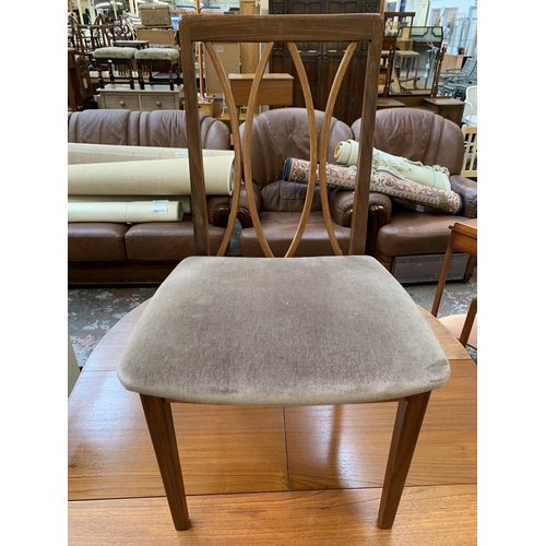 43 - A mid 20th century teak extending dining table and four G Plan teak dining chairs - approx. 71cm hig... 