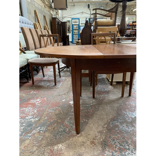 43 - A mid 20th century teak extending dining table and four G Plan teak dining chairs - approx. 71cm hig... 