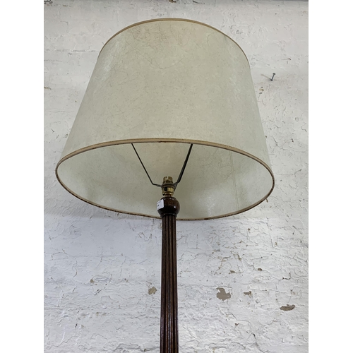 44 - An early/mid 20th century oak reeded standard lamp with circular base - approx. 154cm high (excludin... 