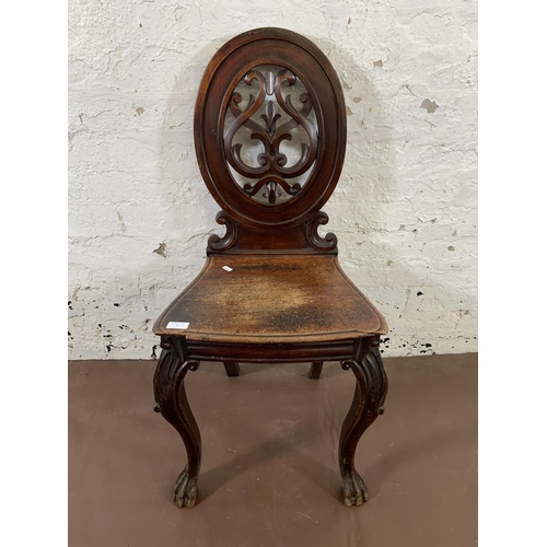 5 - A 19th century carved mahogany hall chair - approx. 92cm high x 44cm wide x 36cm deep