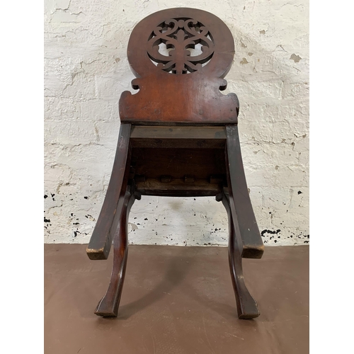 5 - A 19th century carved mahogany hall chair - approx. 92cm high x 44cm wide x 36cm deep