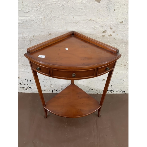 55 - A Bradley yew wood two tier corner occasional table - approx. 80cm high x 59cm wide x 41cm deep